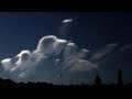 Catalog#:V08787d License:$120.00, Format:1920x1080 Motion JPEG(.AVI) at 30fps, Length: approx.19 sec. Amazing Lenticular 'UFO' cloud Fleet forming with virga trails