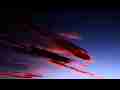 Catalog#:V10841b License:$96.00, Format:1920x1080 Motion JPEG(.AVI) at 30fps, Length: approx.27 sec. Firey lenticular clouds sunset timelapse (zoomed)